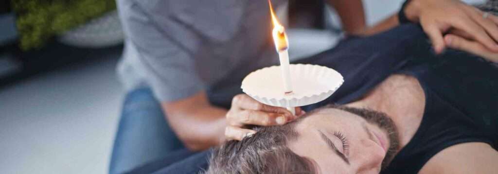 Why should I avoid using an ear candle?